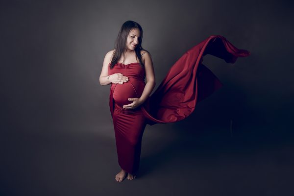 Maternity photo in red dress